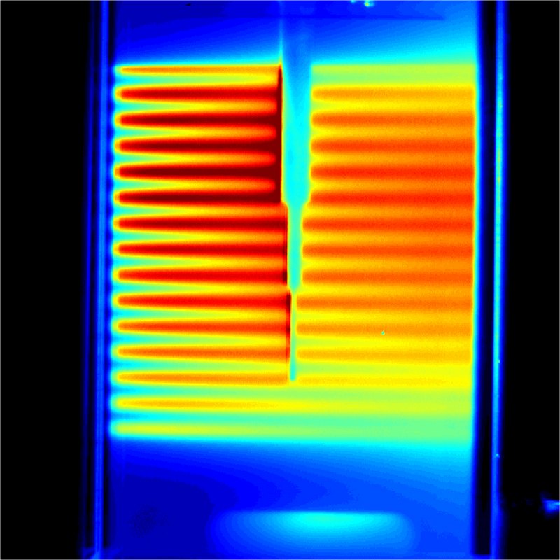 Image of a spray illuminated with a striped, modulated laser sheet